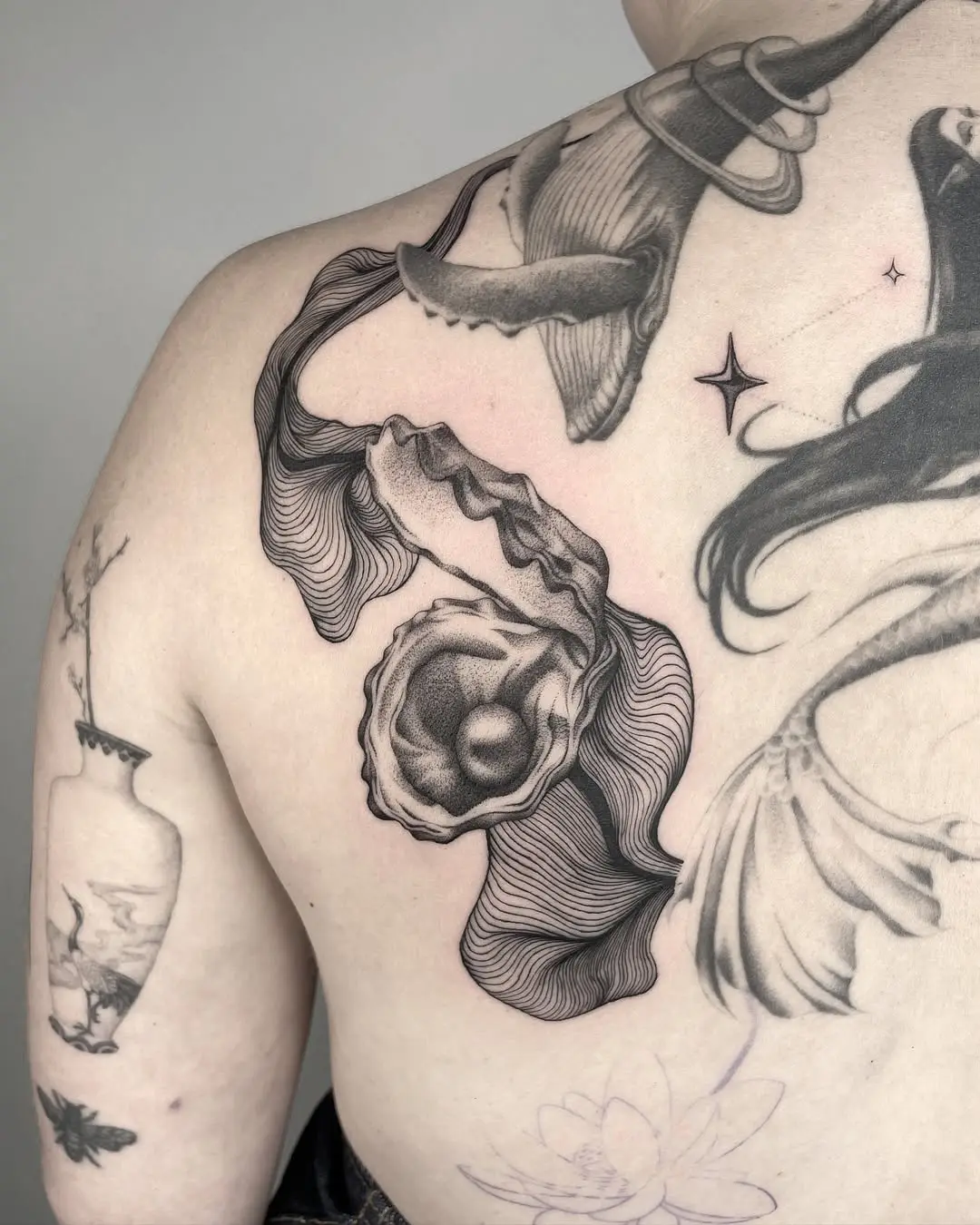 Intricate and artistic oyster tattoo design