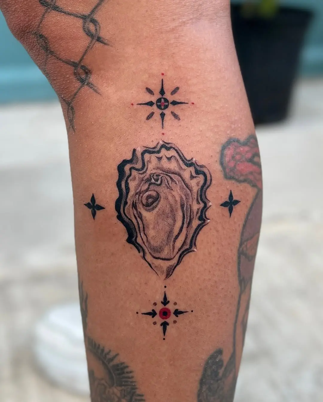 Stylish oyster tattoo with intricate detailing