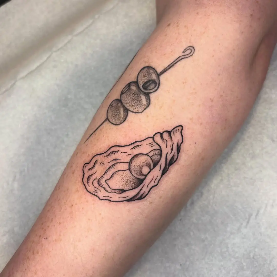 Artistic oyster tattoo showcasing intricate details