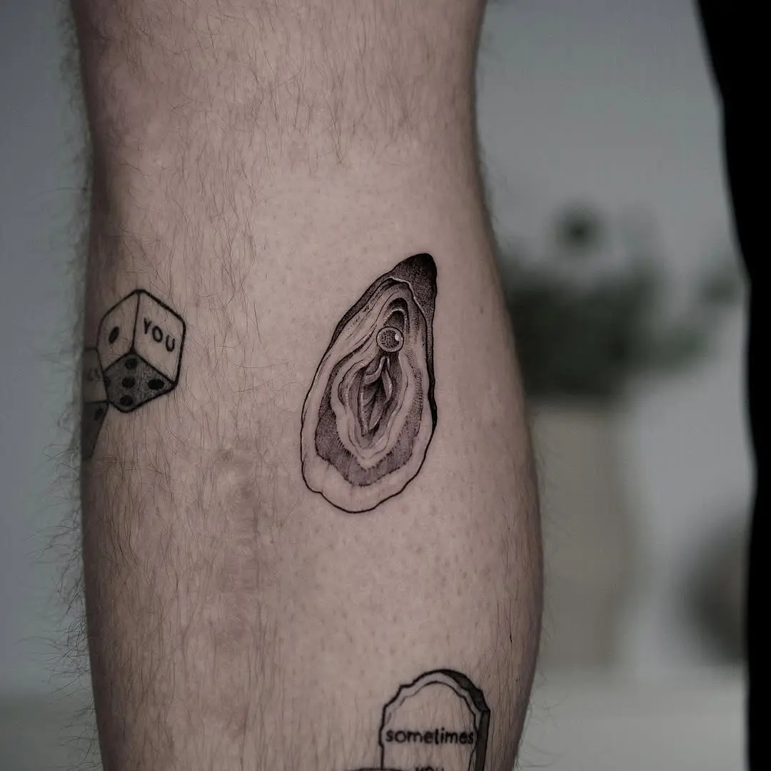 Elegant oyster tattoo on the leg