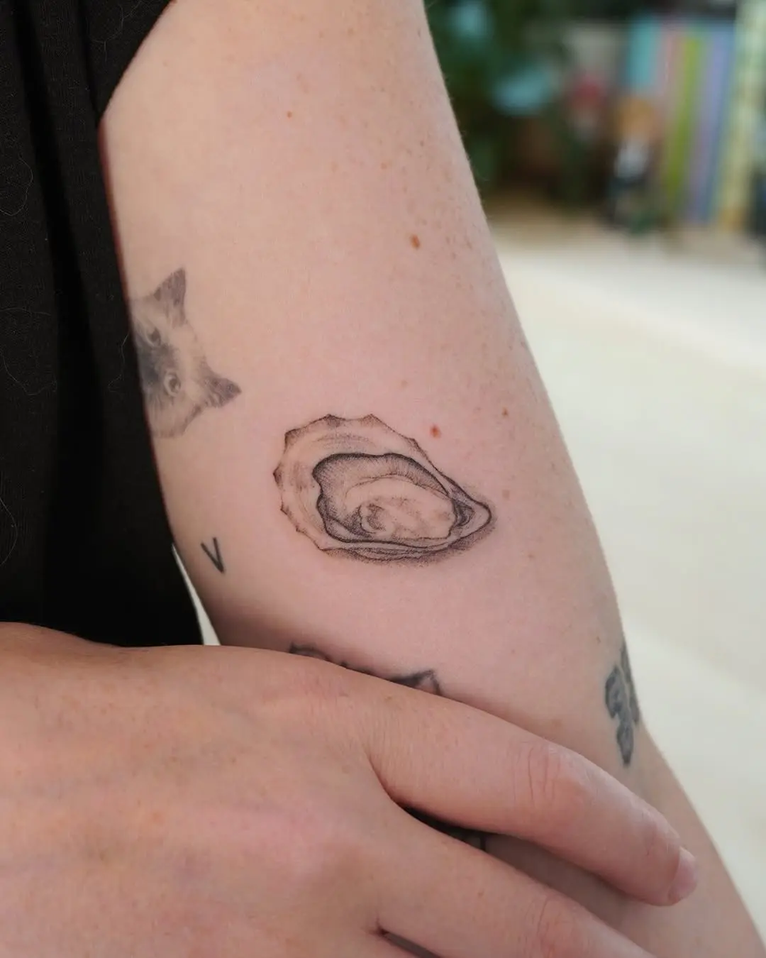 Intricate oyster tattoo showcasing detailed artistry