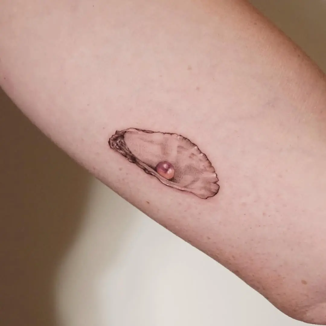 Realistic oyster tattoo with pearl detail
