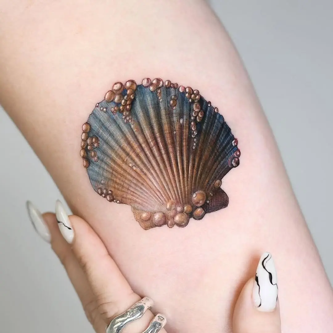 Stunning realistic oyster tattoo on display