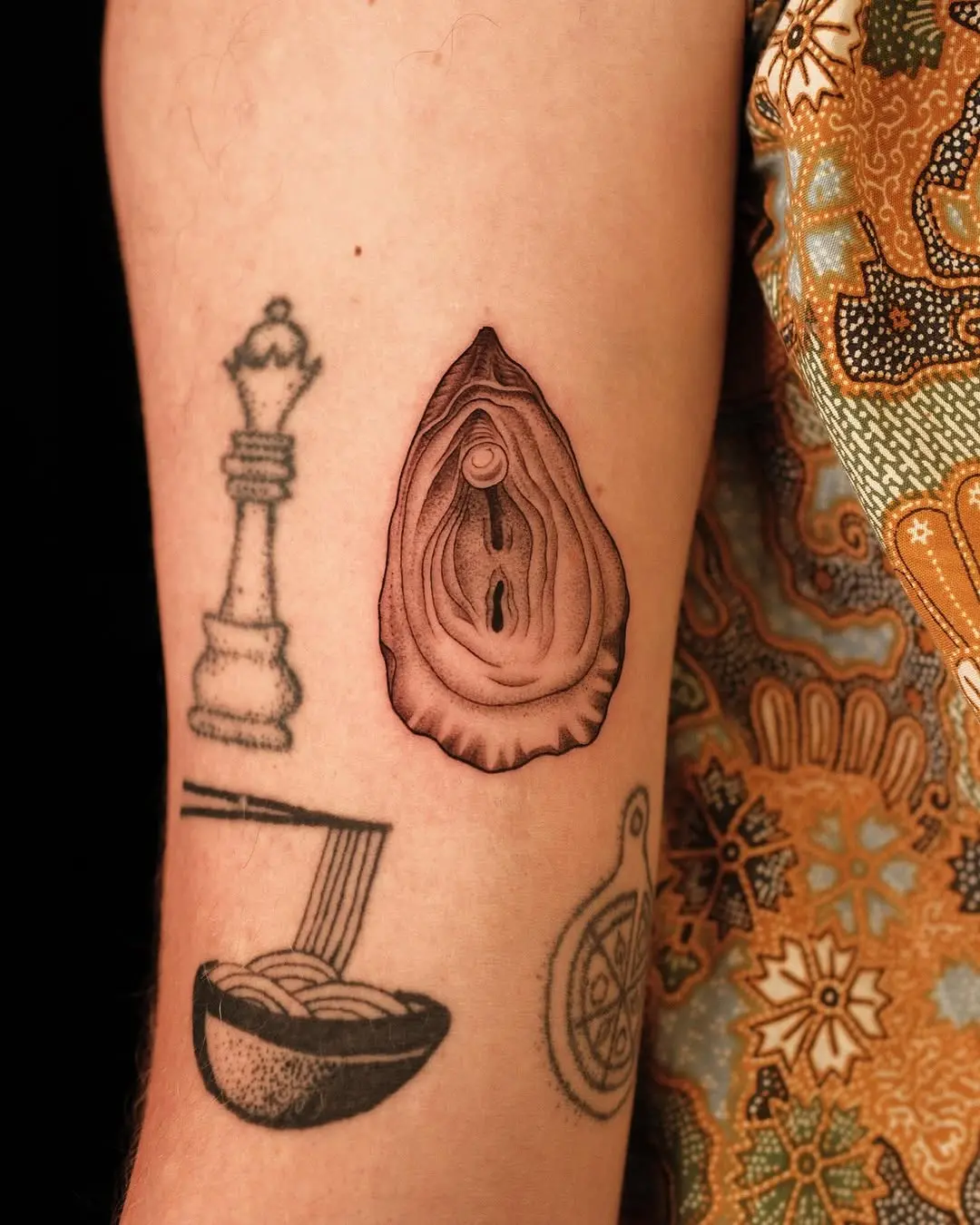 Exquisite realistic oyster tattoo design on skin