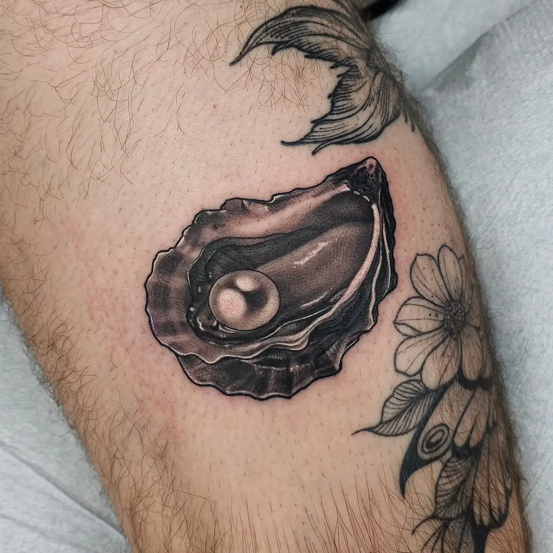 Realistic oyster tattoo showcasing a pearl inside