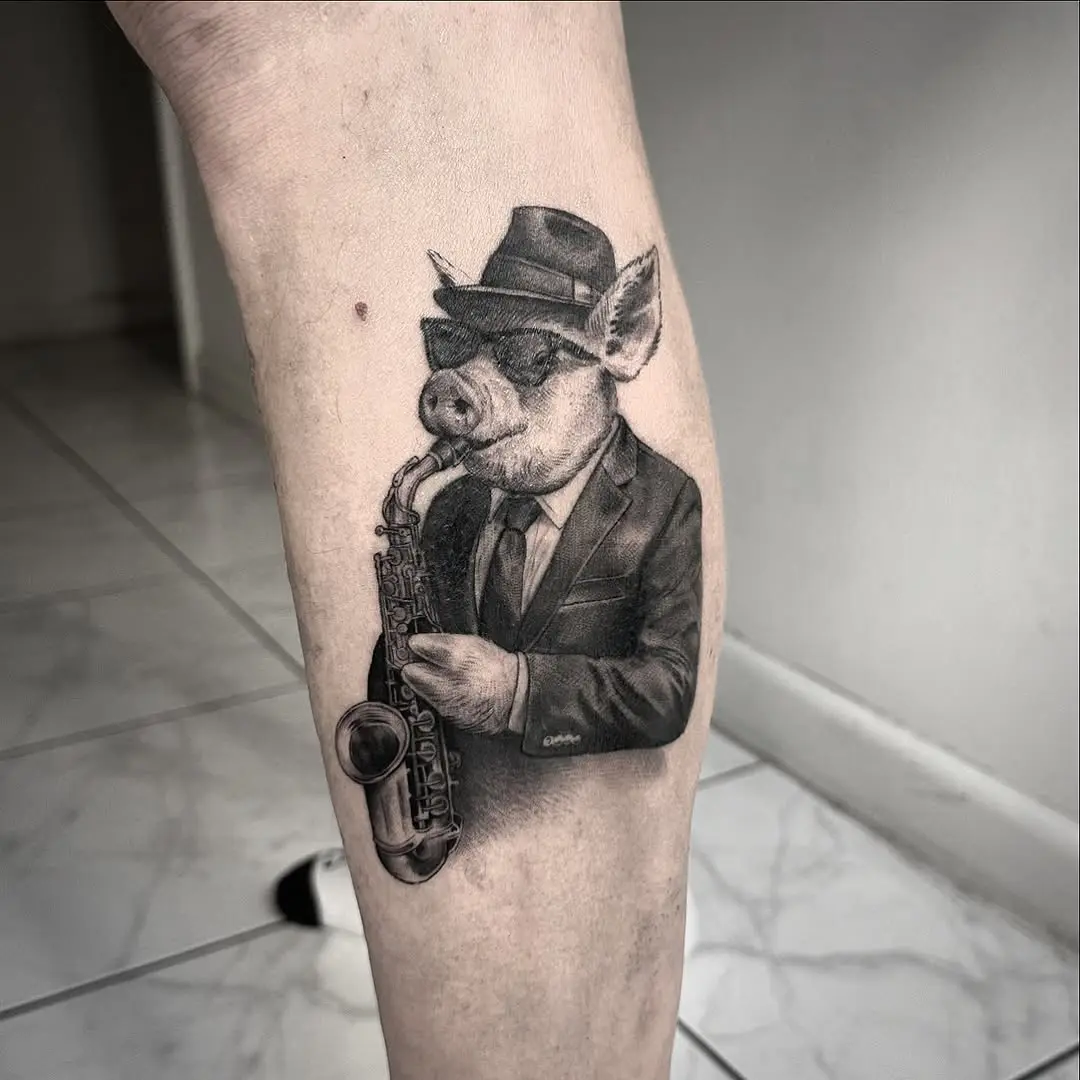 Whimsical pig playing saxophone tattoo art