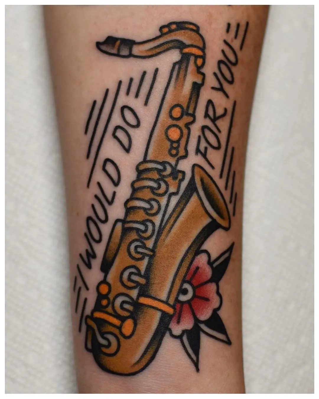 Unique saxophone tattoo with heartfelt quote