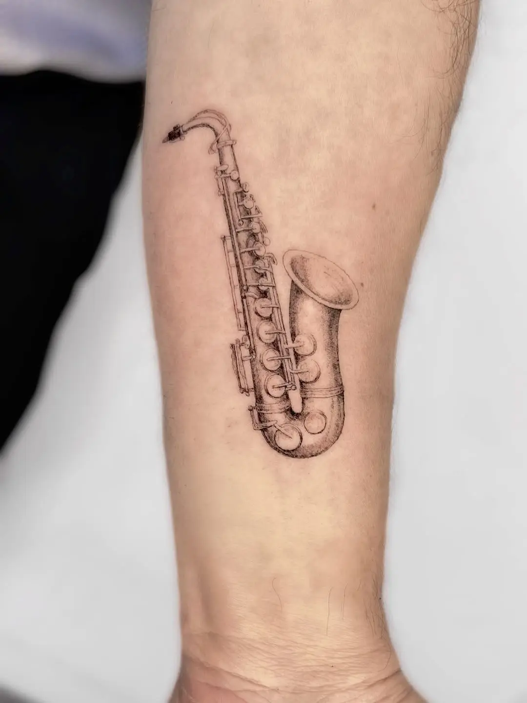 A stunning saxophone tattoo for music lovers