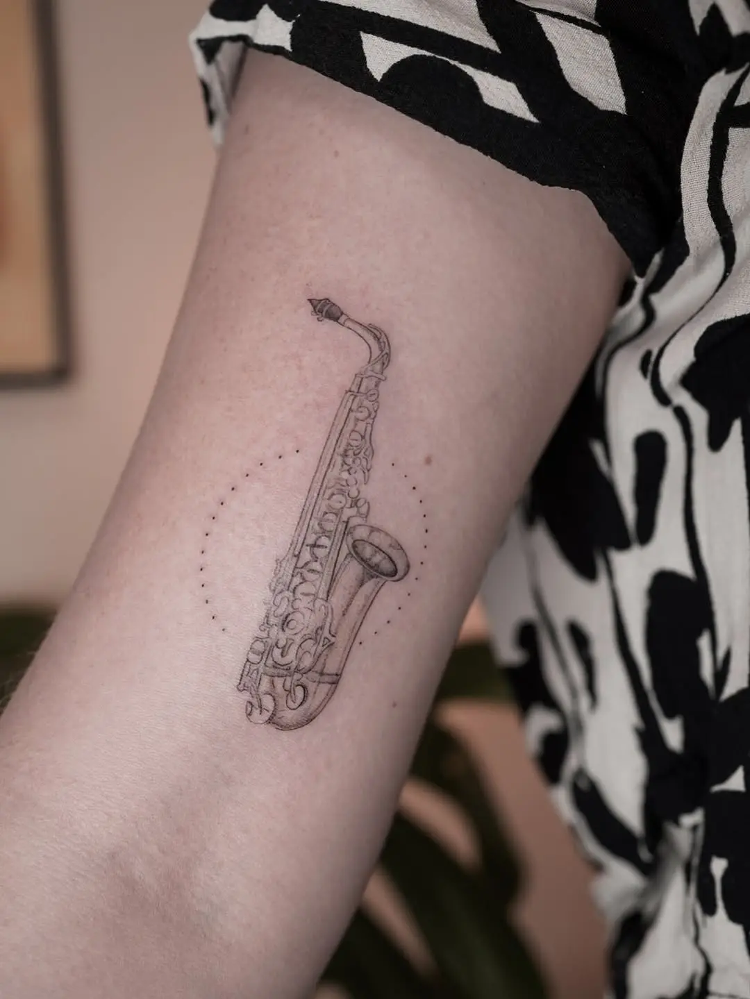 Unique saxophone tattoo showcasing artistic flair