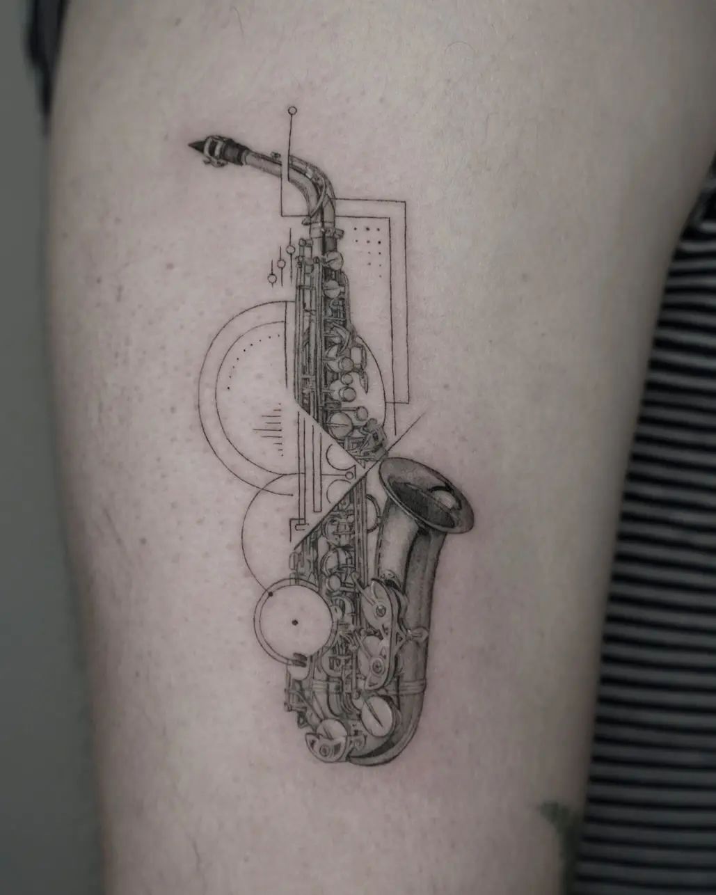 Elegant fine line saxophone tattoo design