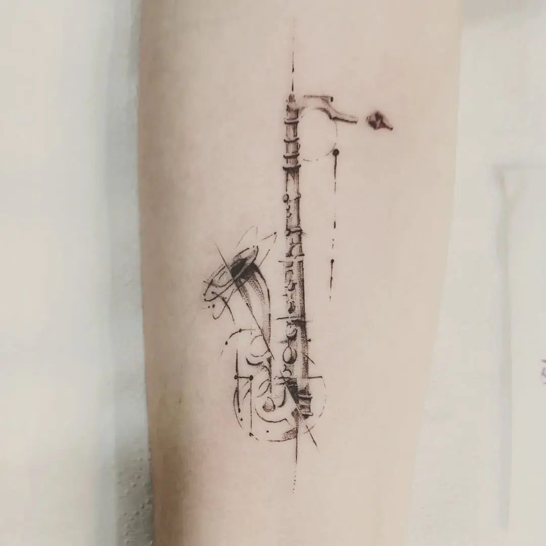 Stylish saxophone tattoo with elegant lines