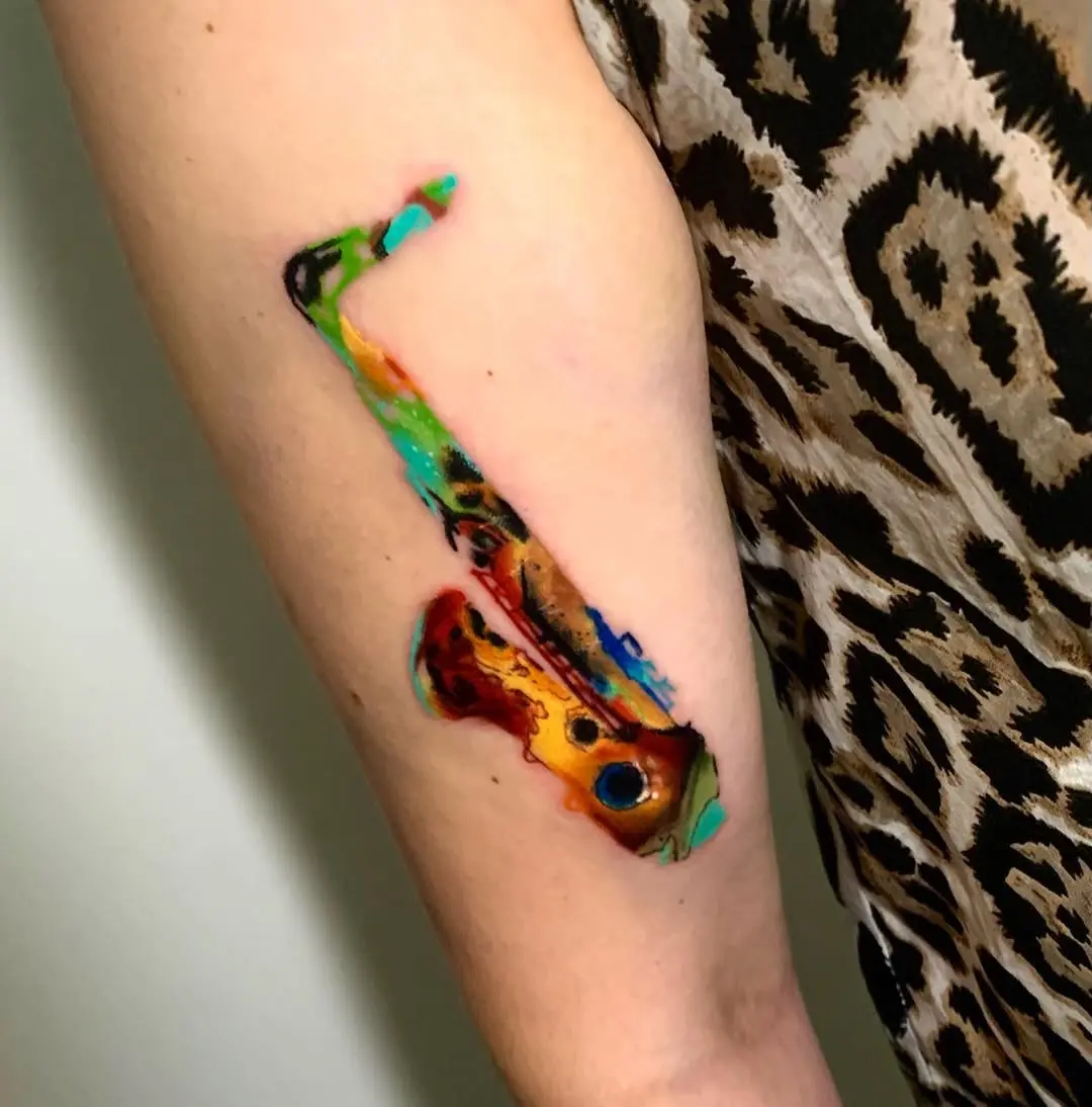 Vivid saxophone tattoo with artistic flair