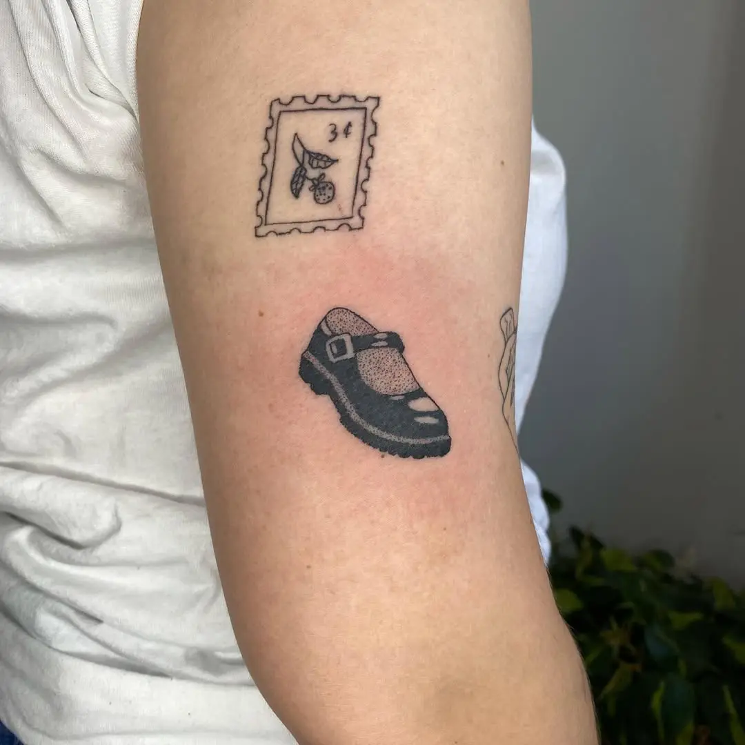 Unique shoe tattoo with vintage stamp design