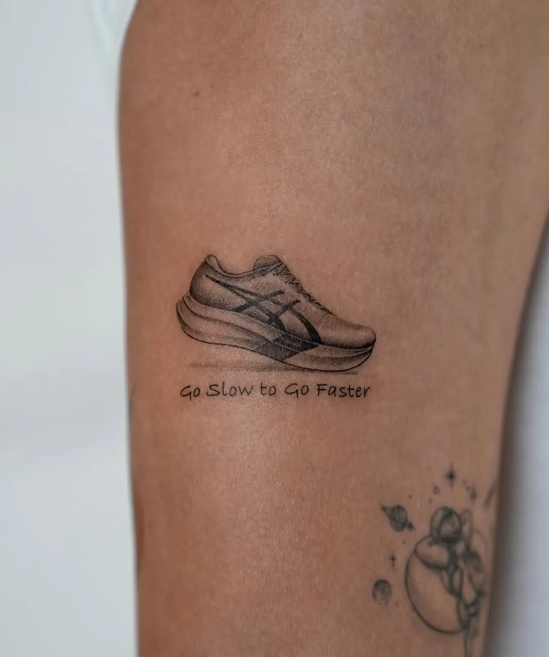 Stylish shoe tattoo with motivational phrase