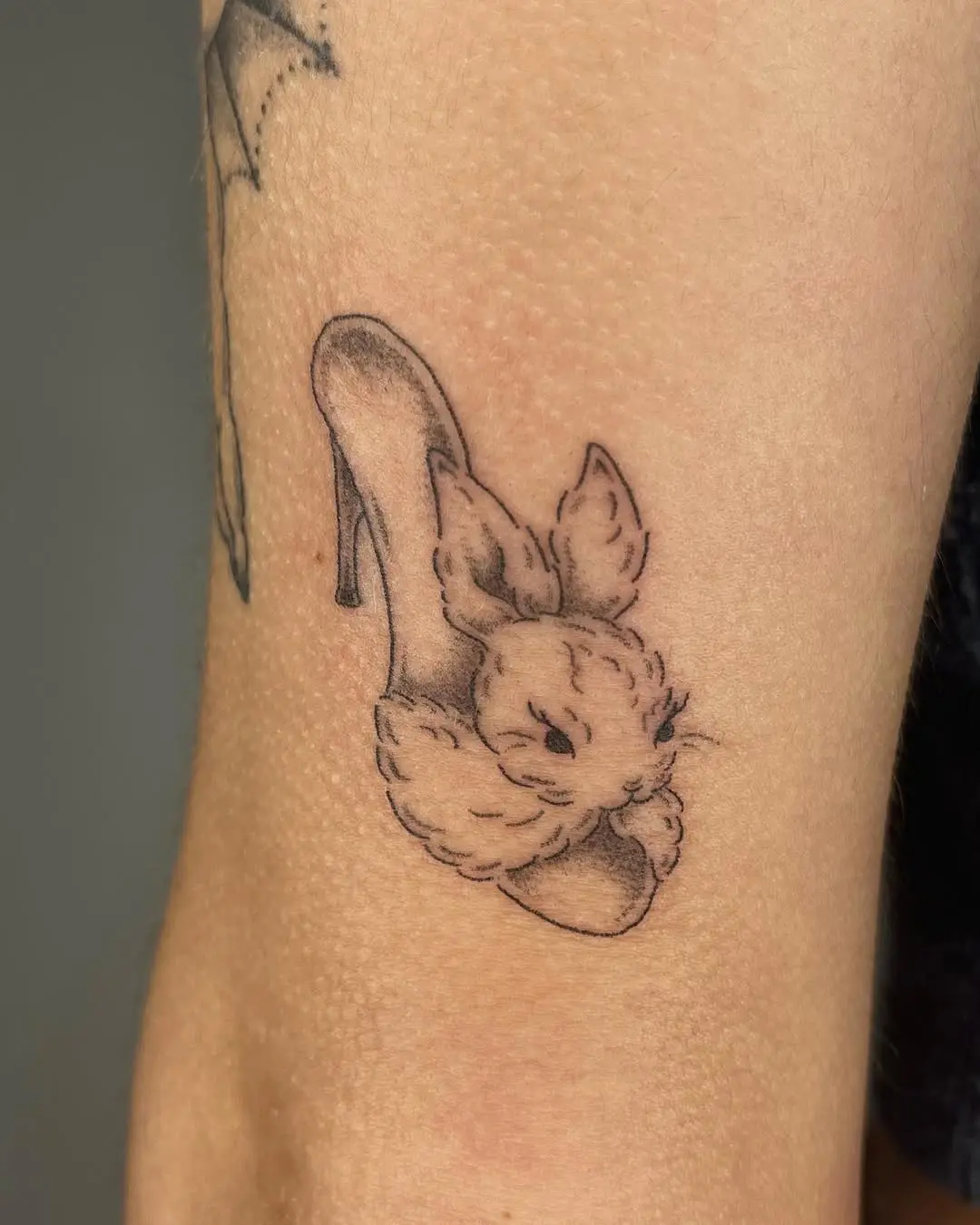 Adorable bunny-heels tattoo design on skin