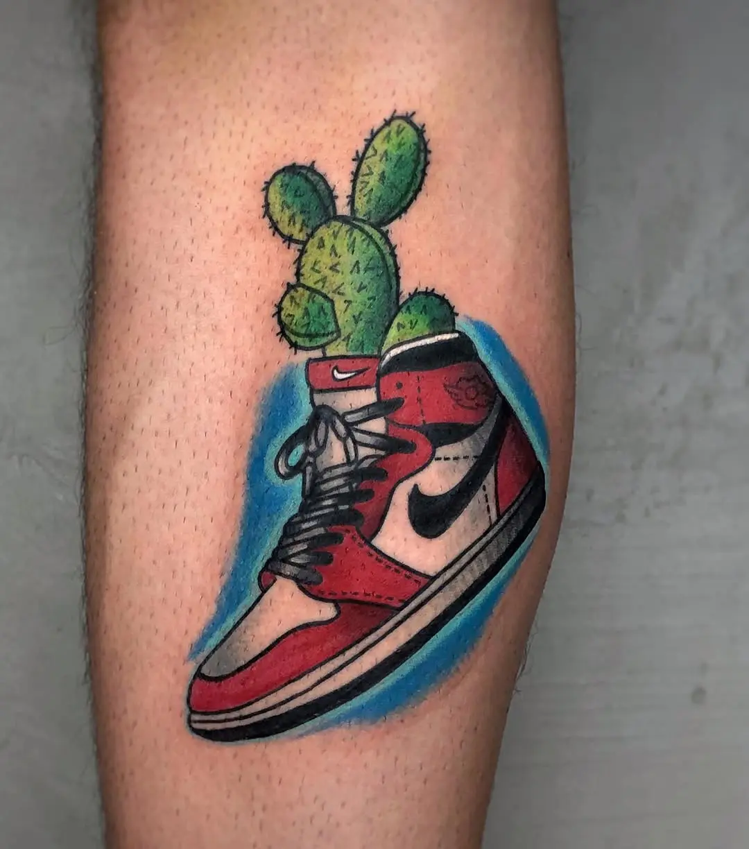 Playful sneaker tattoo with a cactus twist