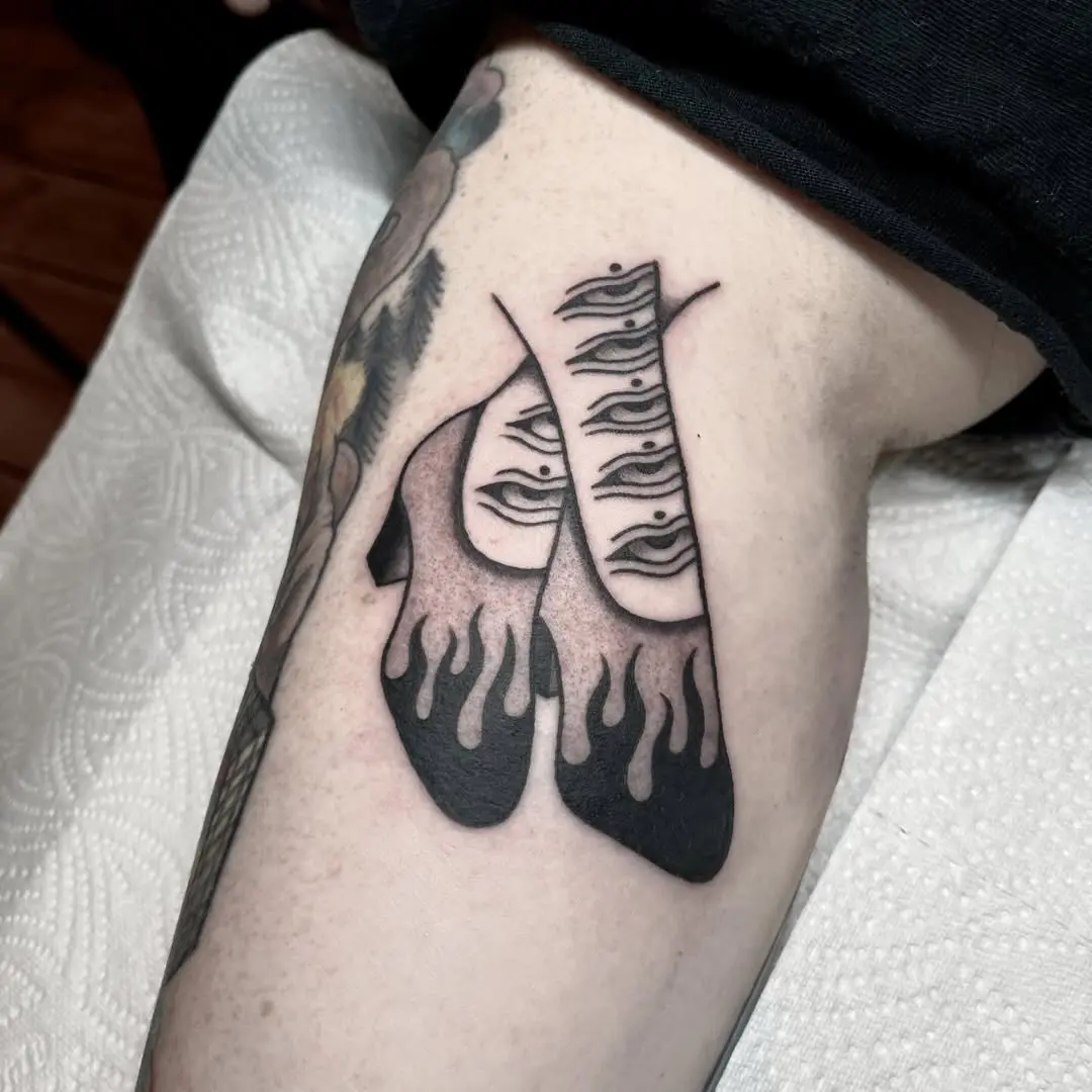 Stylish shoe tattoo with flame aesthetics