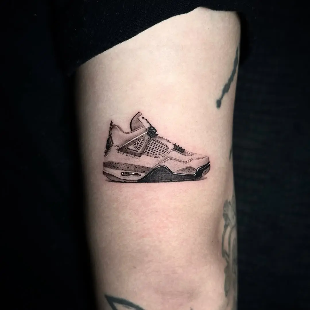 Realistic sneaker tattoo on the forearm