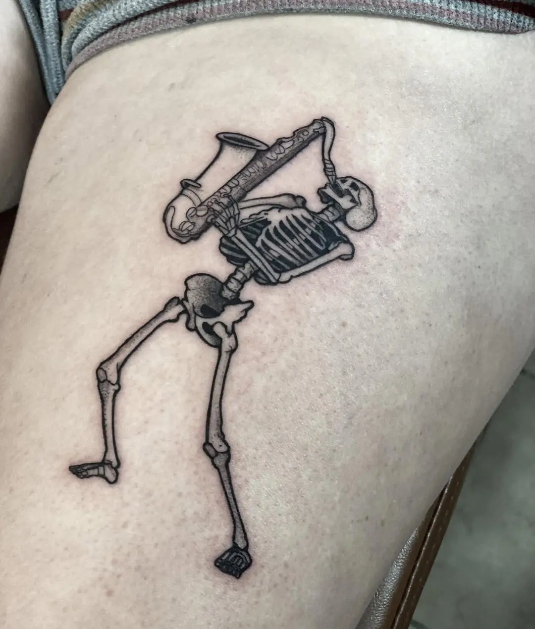 Unique Skeleton Playing Saxophone Tattoo Design