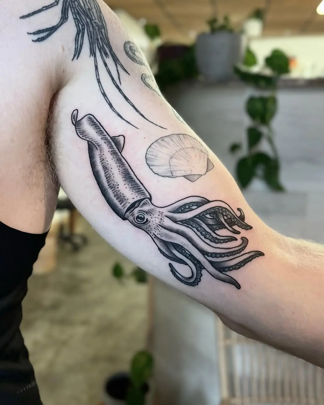 Elegant Squid Tattoo with Shell Design