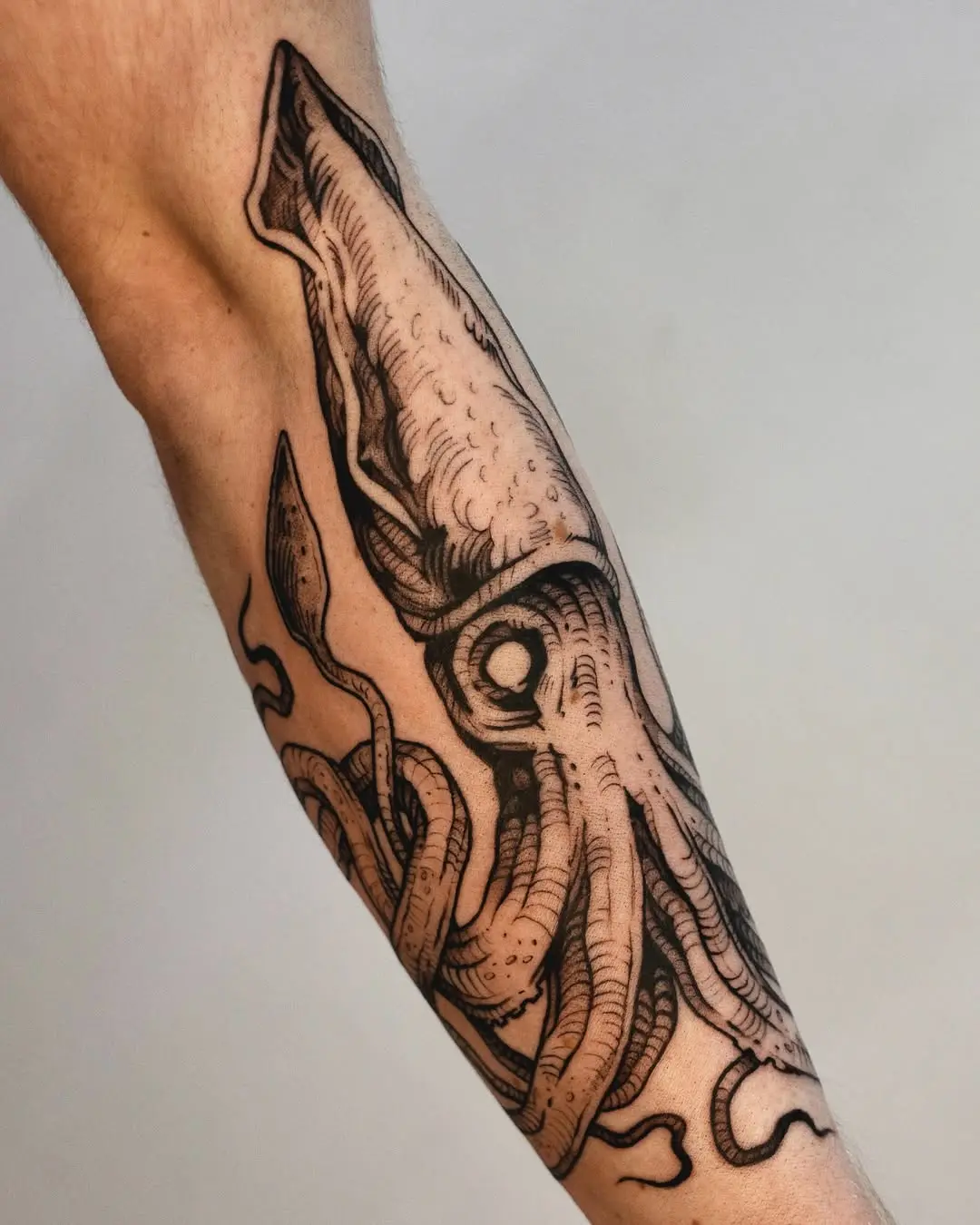 Intricate Squid Tattoo on Forearm