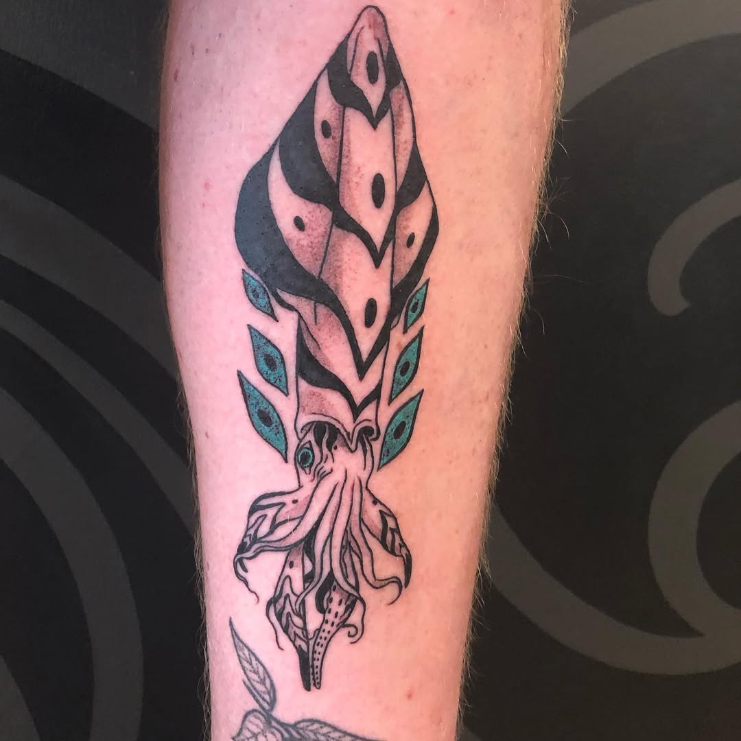 vibrant squid tattoo with bold designs