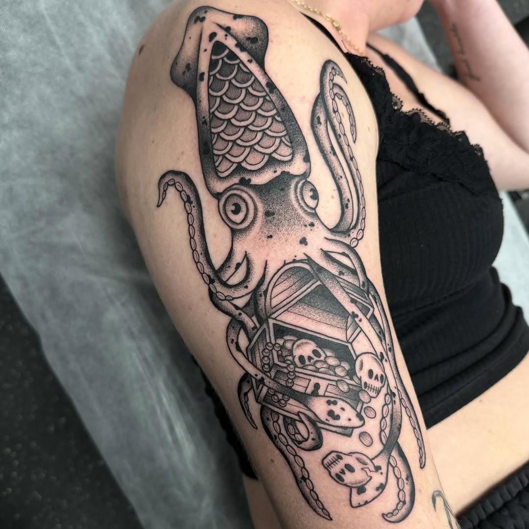 Intricate squid tattoo with hidden details