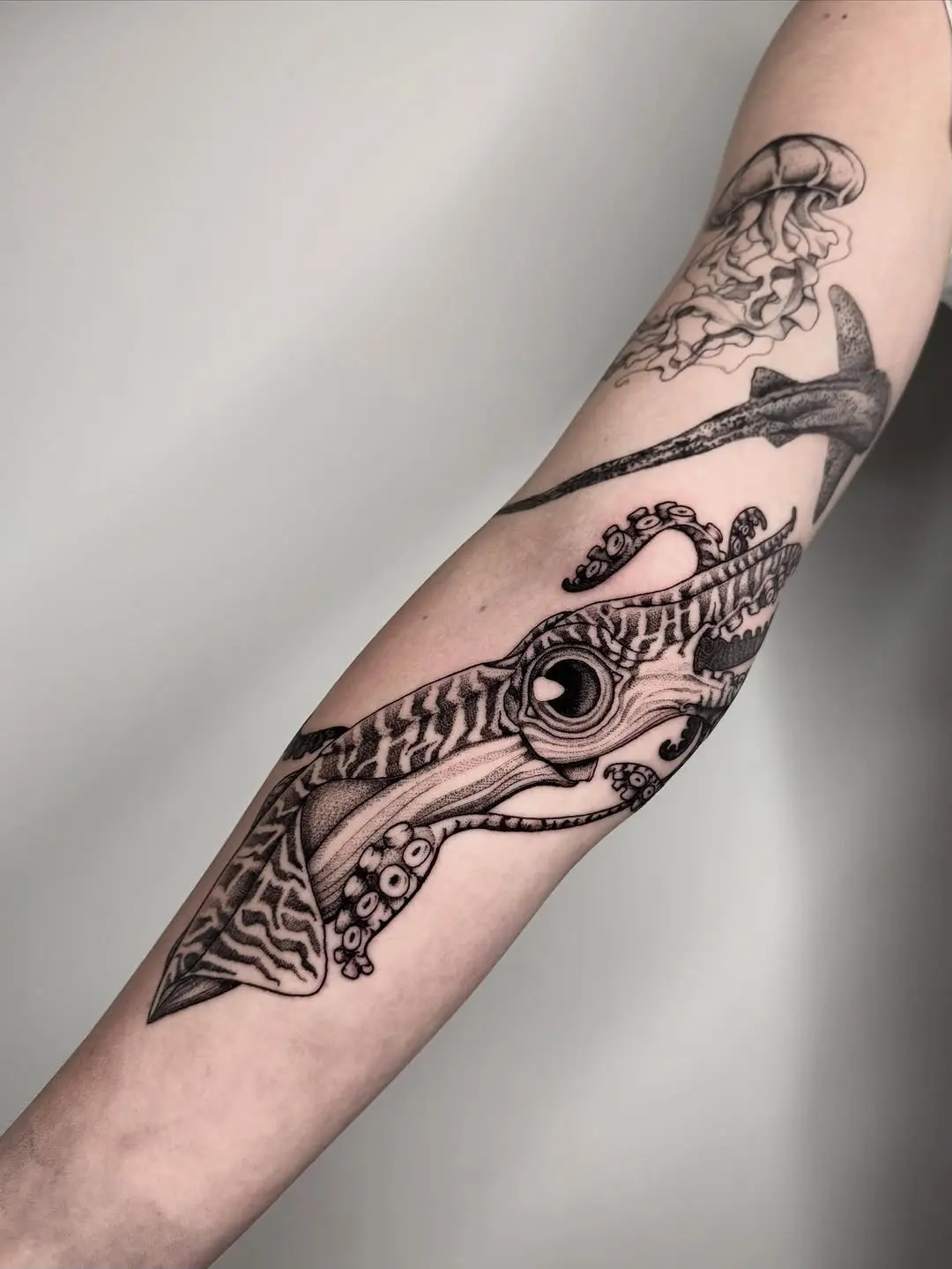 Stylish squid tattoo showcasing intricate details.