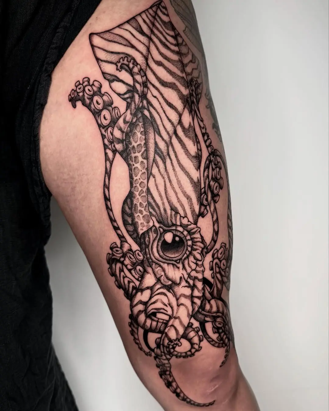 Intricate squid tattoo with bold black lines