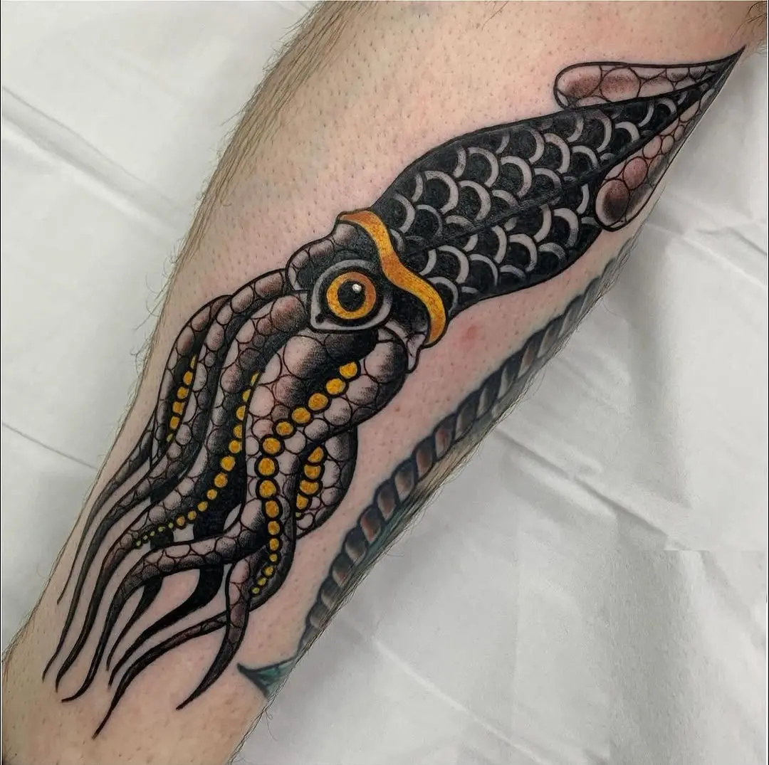 Bold and colorful squid tattoo on leg