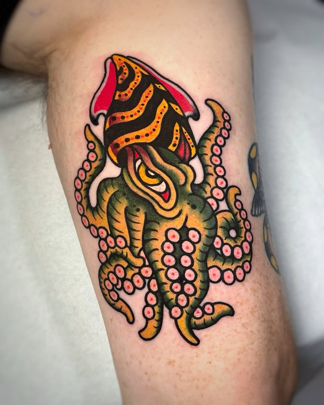 Bold squid tattoo with traditional elements