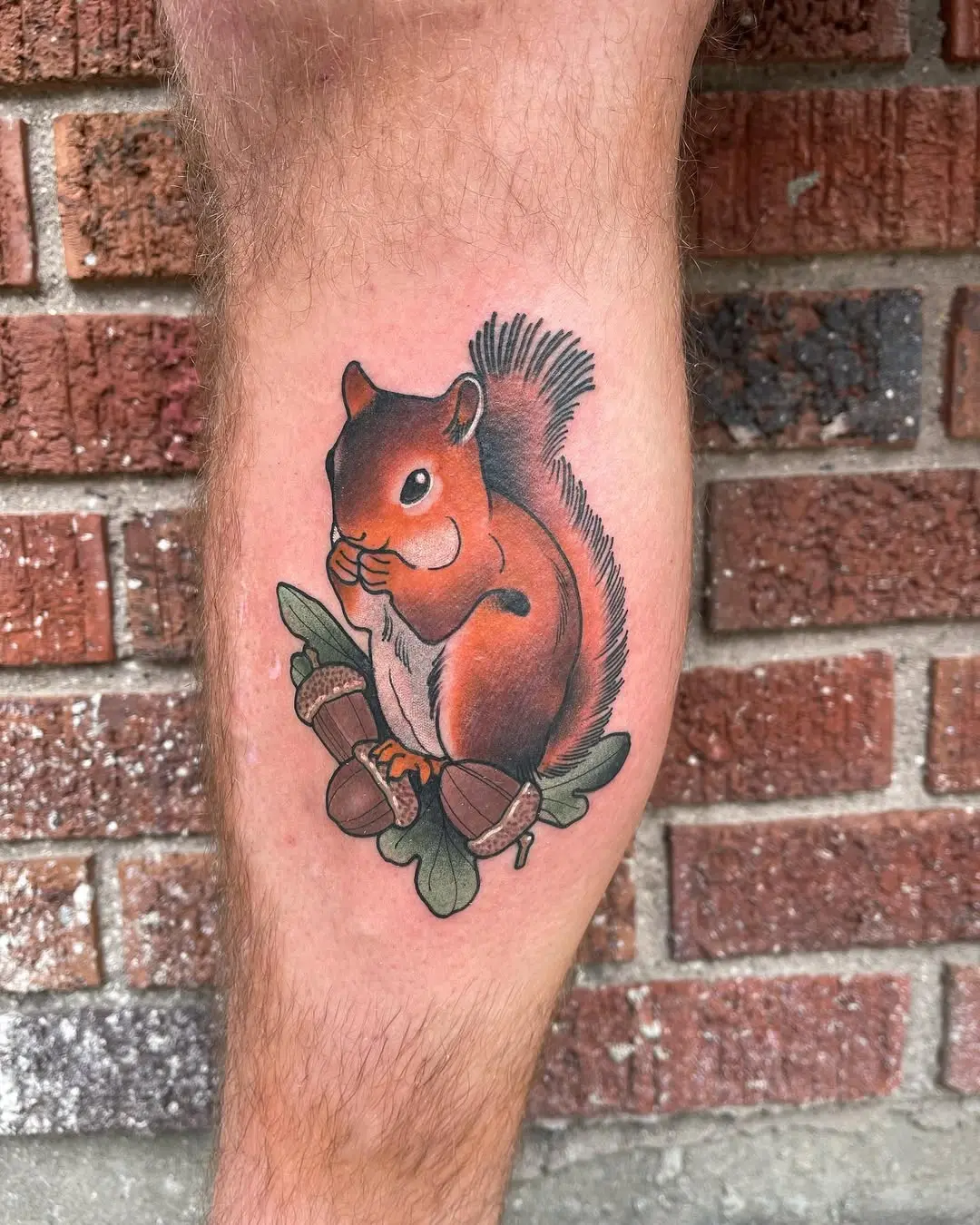 Detailed squirrel tattoo with acorns and leaves