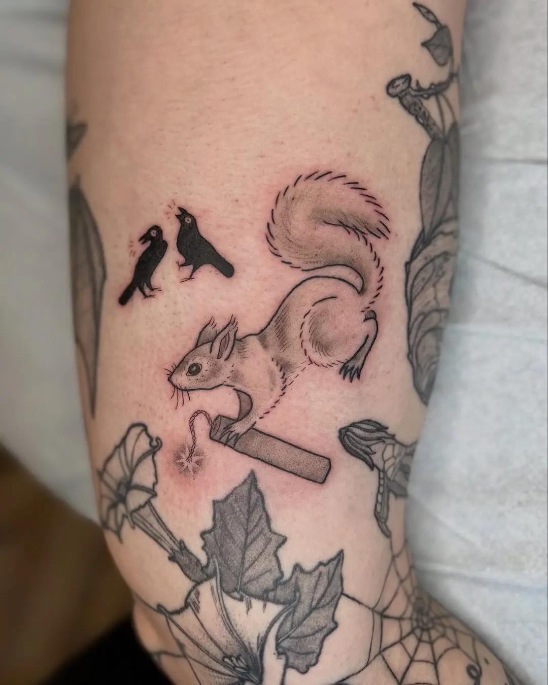 Charming squirrel tattoo with whimsical elements