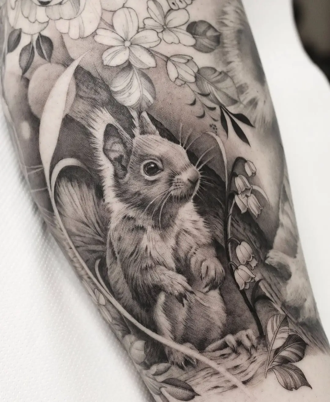 Intricate black-and-grey squirrel tattoo design