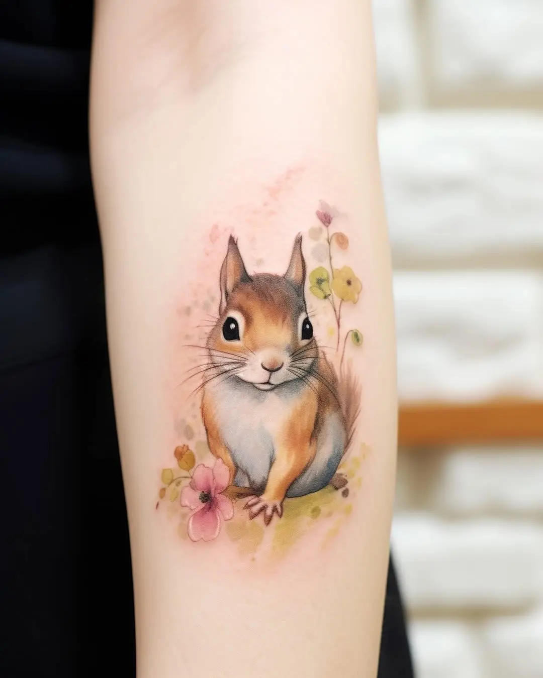 Charming squirrel tattoo with floral accents