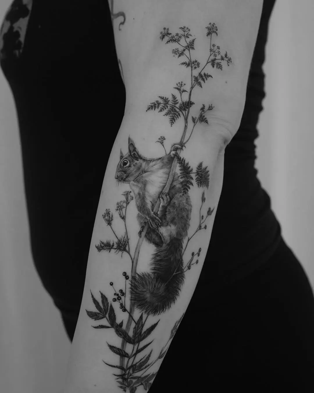 Stunning blackwork squirrel surrounded by foliage