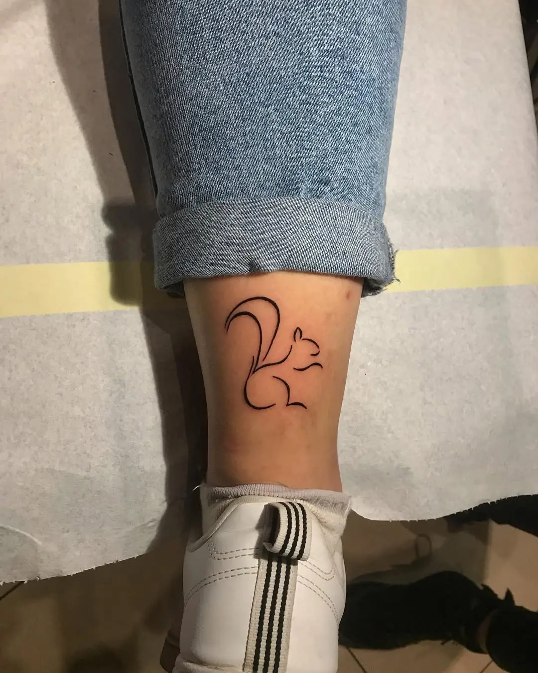 Minimalist Squirrel Tattoo on Ankle