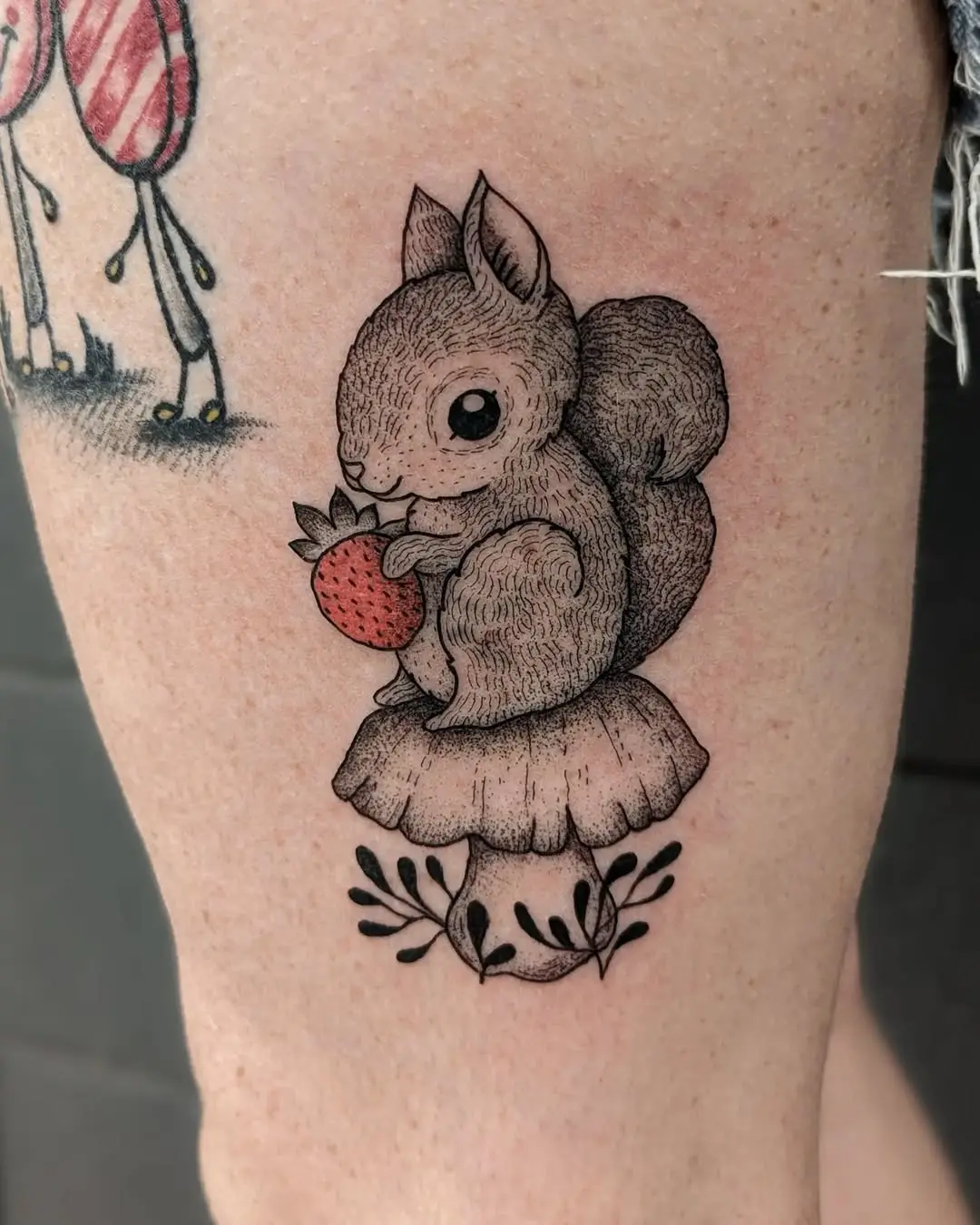 Charming squirrel tattoo with berry on mushroom