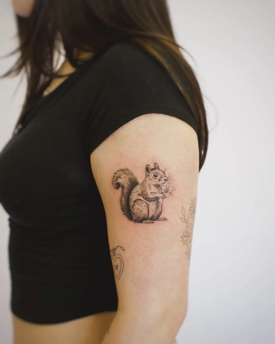 Charming Squirrel Tattoo on Woman's Arm