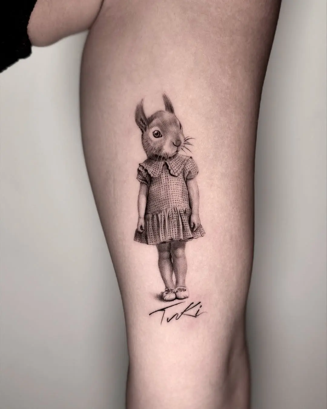 Whimsical squirrel tattoo with vintage girl vibe