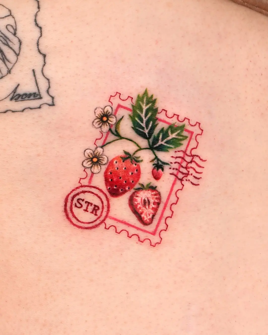 Colorful strawberry tattoo with vintage stamp design
