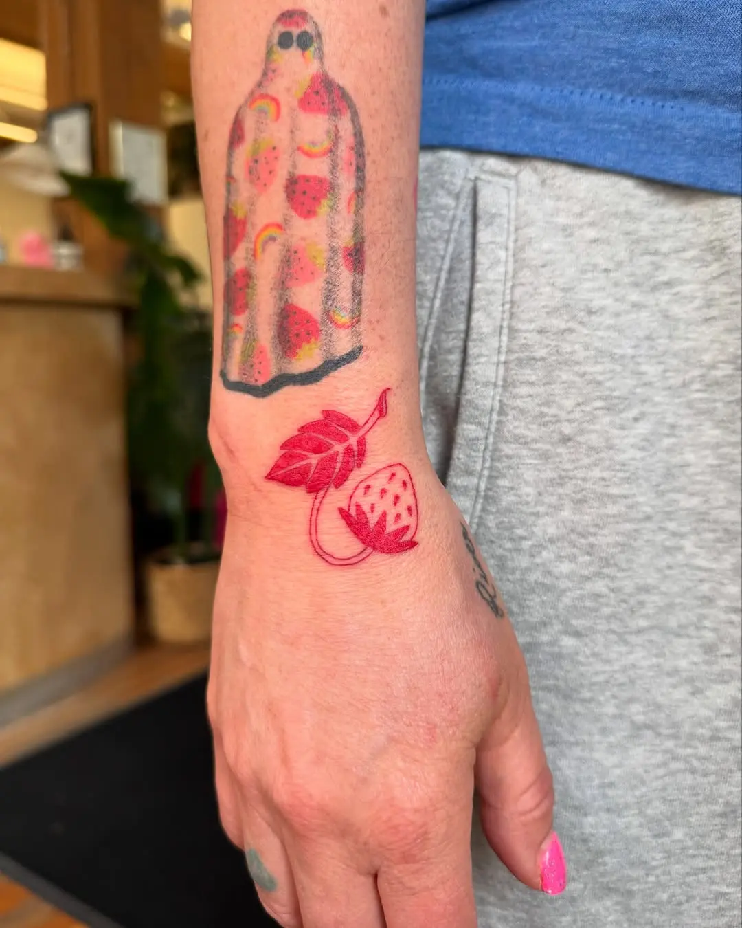 Playful strawberry tattoos for a vibrant look