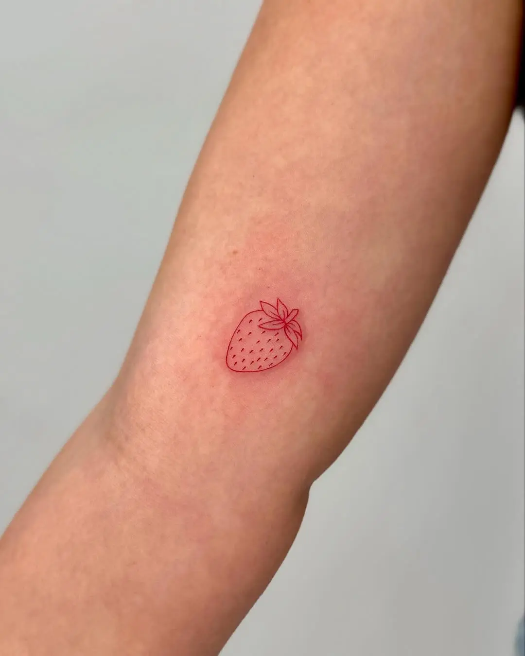 Minimalist Strawberry Tattoo in Red Ink