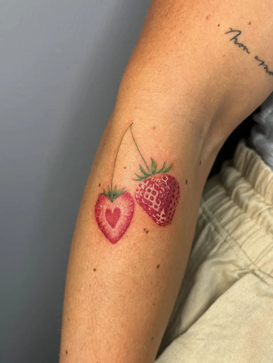 Charming Strawberry Tattoos with Heart Details