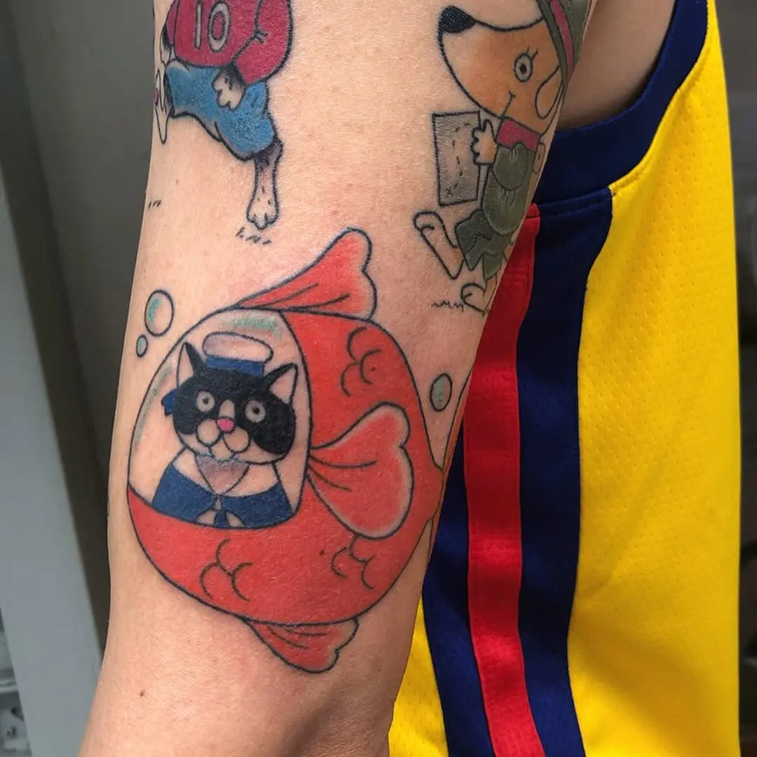 Playful cat in a submarine design tattoo