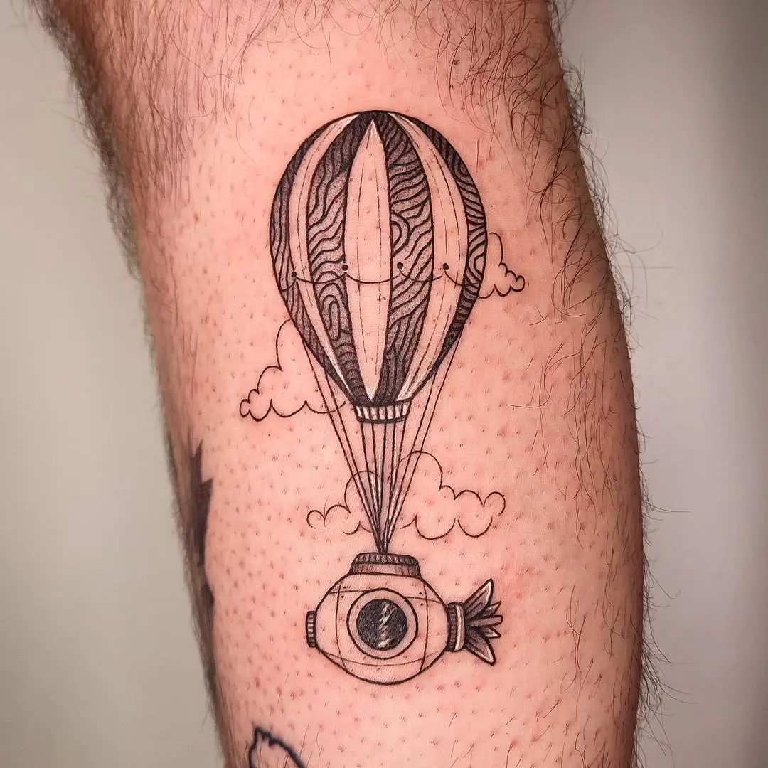Unique blend of submarine and hot air balloon tattoo