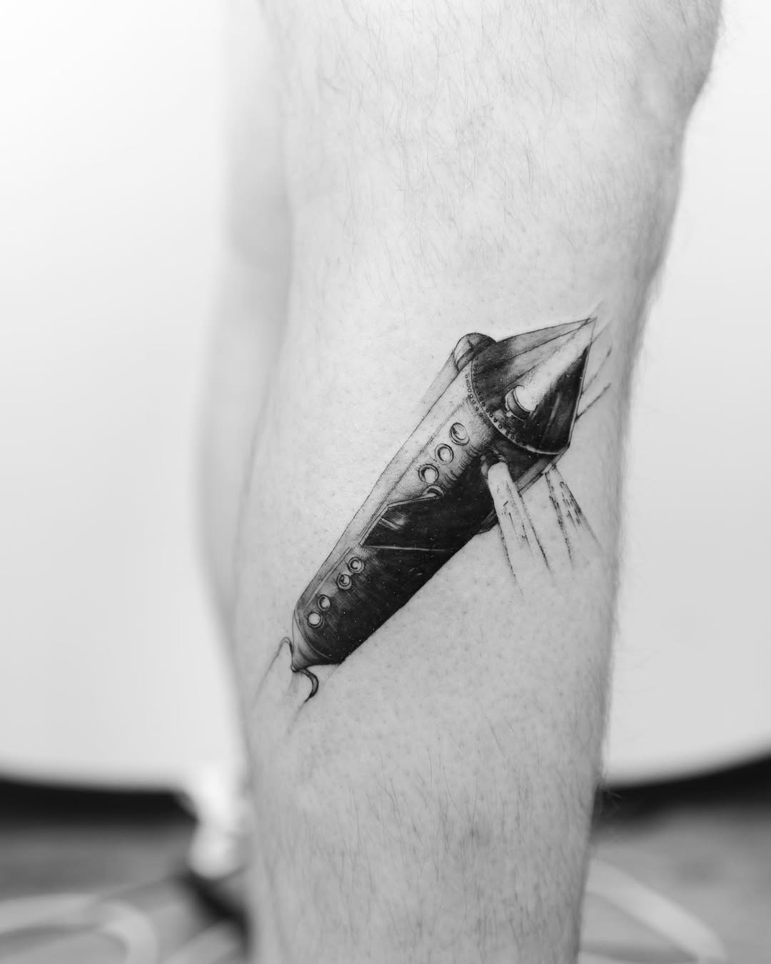 Intricate black and white submarine tattoo design