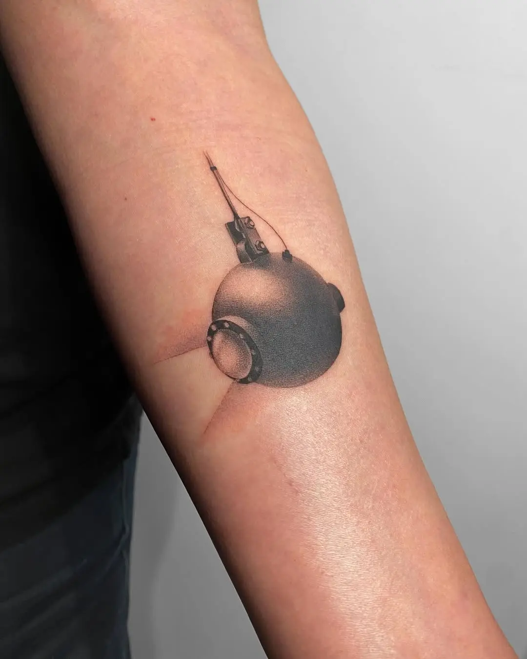 Artistic submarine tattoo showcasing exploration vibes