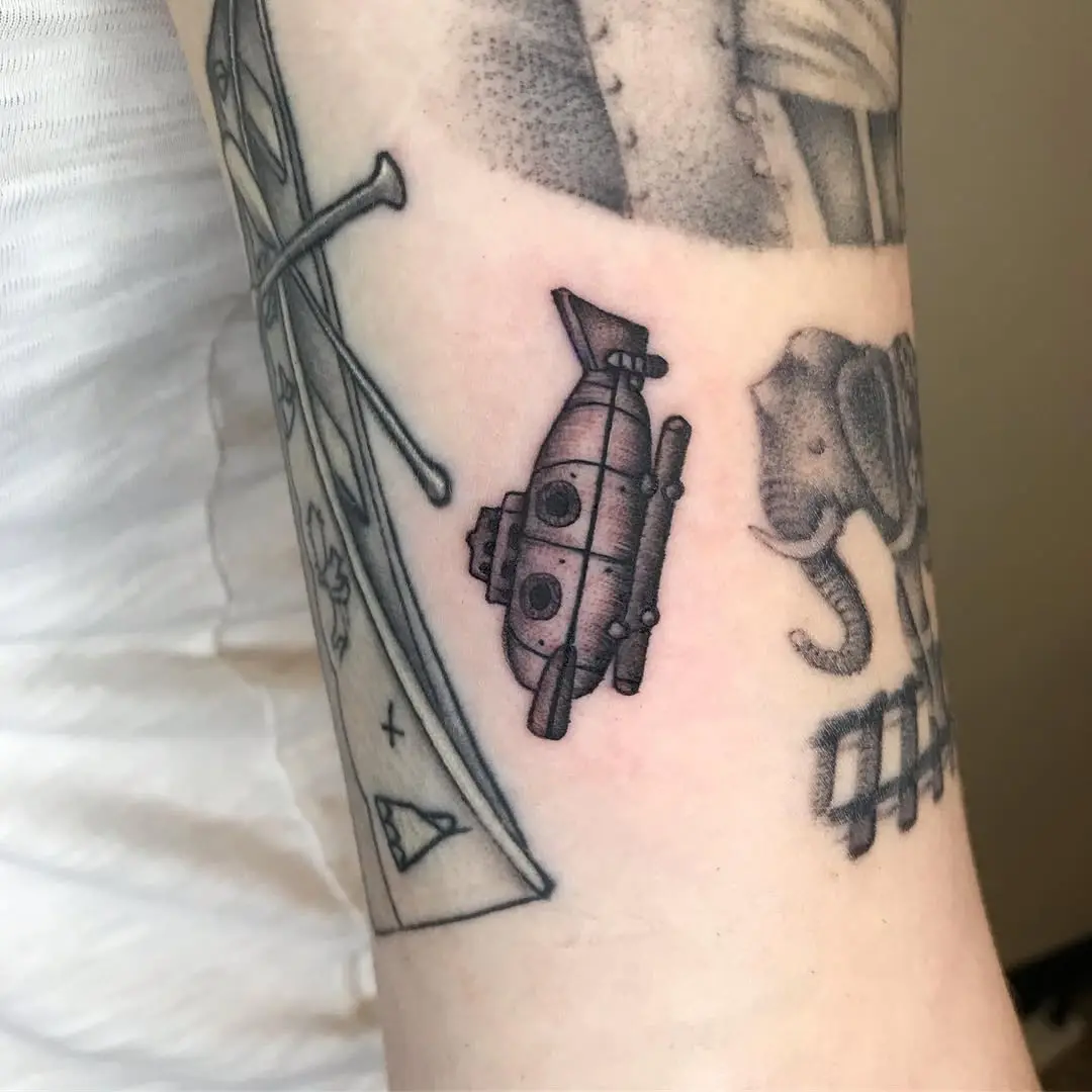 Charming submarine tattoo on arm
