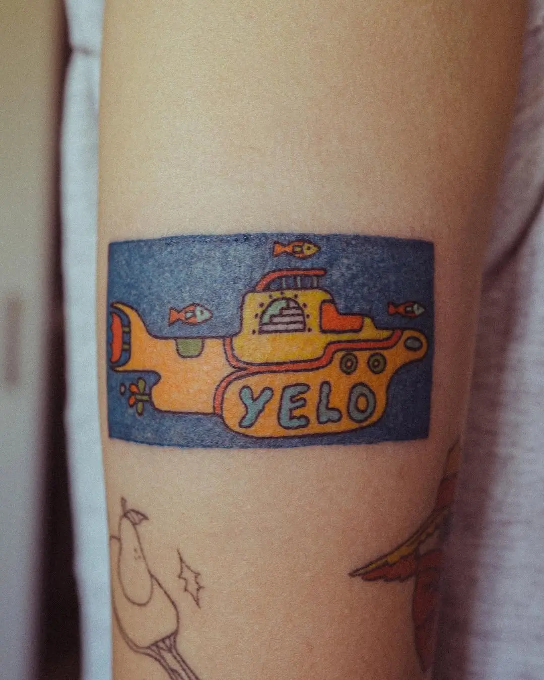 Unique yellow submarine tattoo design